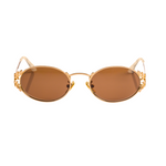 Gold-framed sunglasses with brown lenses on a white background