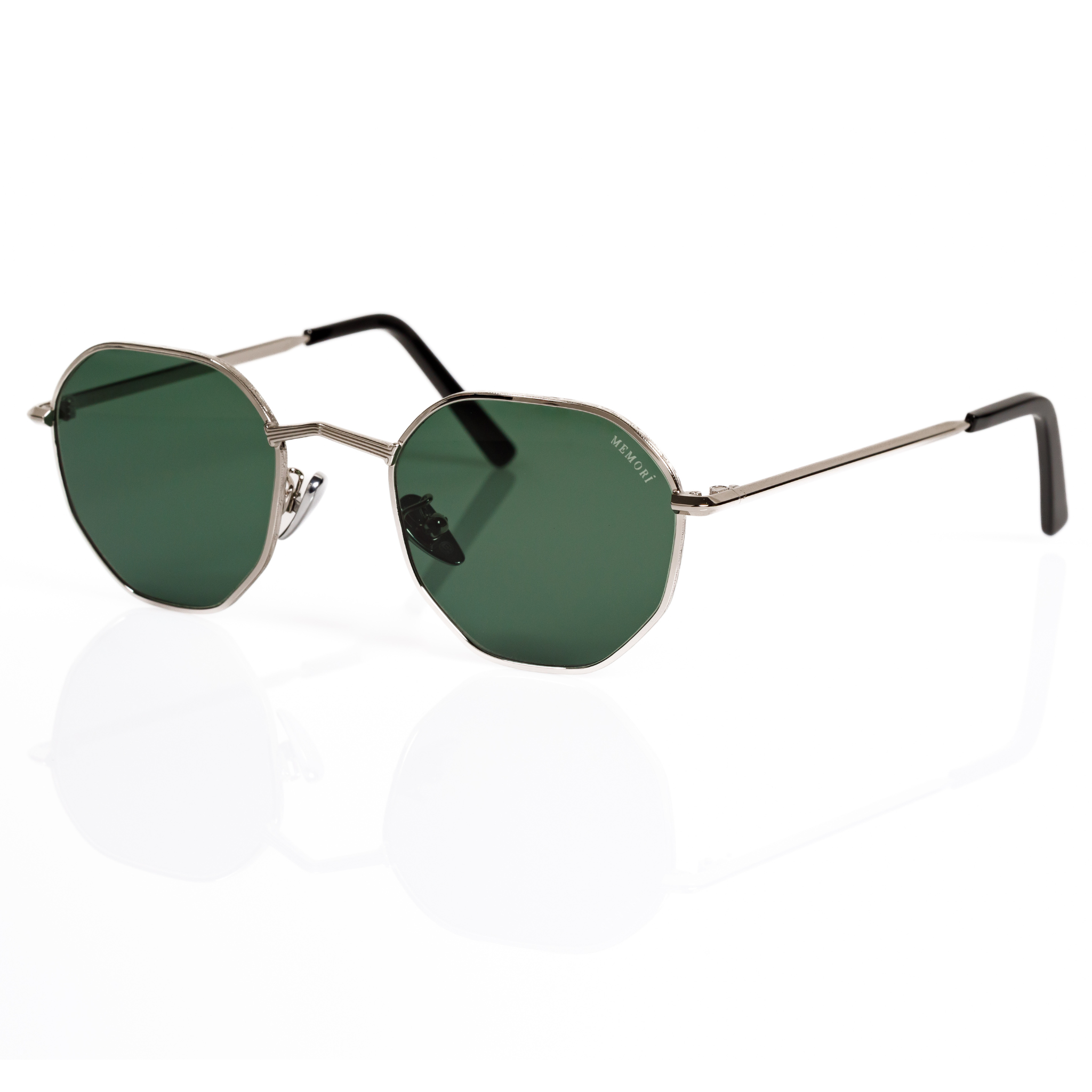 side view of Memorí silver sunglasses, the best sunglasses for small faces. angular nose bridge featured alongside green lenses.