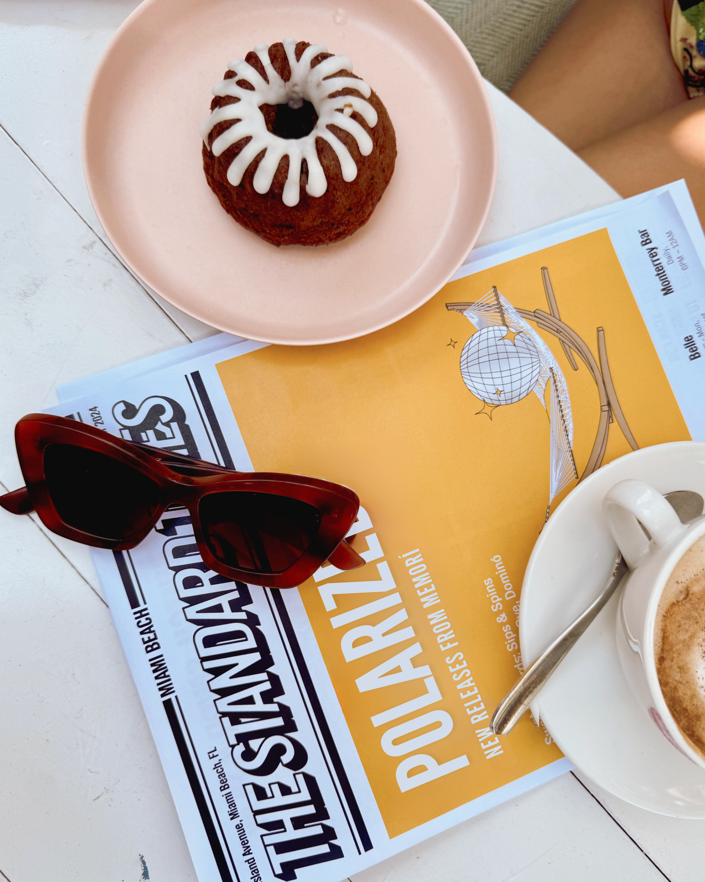 Arial view photograph of Memori cat eye sunglasses on top of a newspaper announcing the NEW polarized styles available from Memorí.