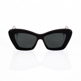Black cat eye sunglasses for women - view shown from the front. Features a sleek, curved top with square bottoms, kind of like a cat eye sunglass and a wayfarer hybrid. Materials are black Italian acetate with dark gray lenses, which appear black to the eye in most light conditions.