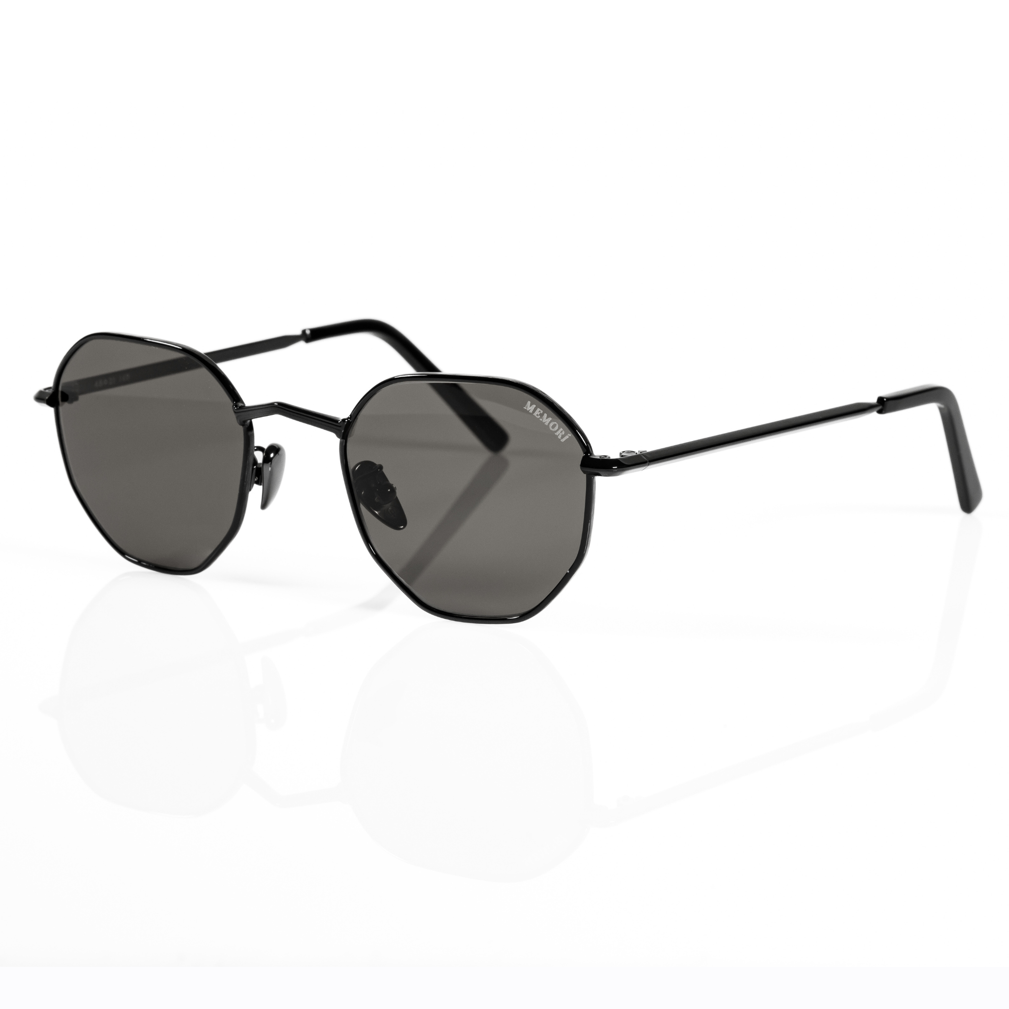 3/4 view of black sunglasses designed for small face shape. Features black polarized lenses and black metallic ceramic nose pads.