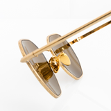 Polarized sunglasses for small faces gold metal men women macro internal view showcases gold ceramic adjustable nose pads, which are hypoallergenic and match gold color of sunglass frame.