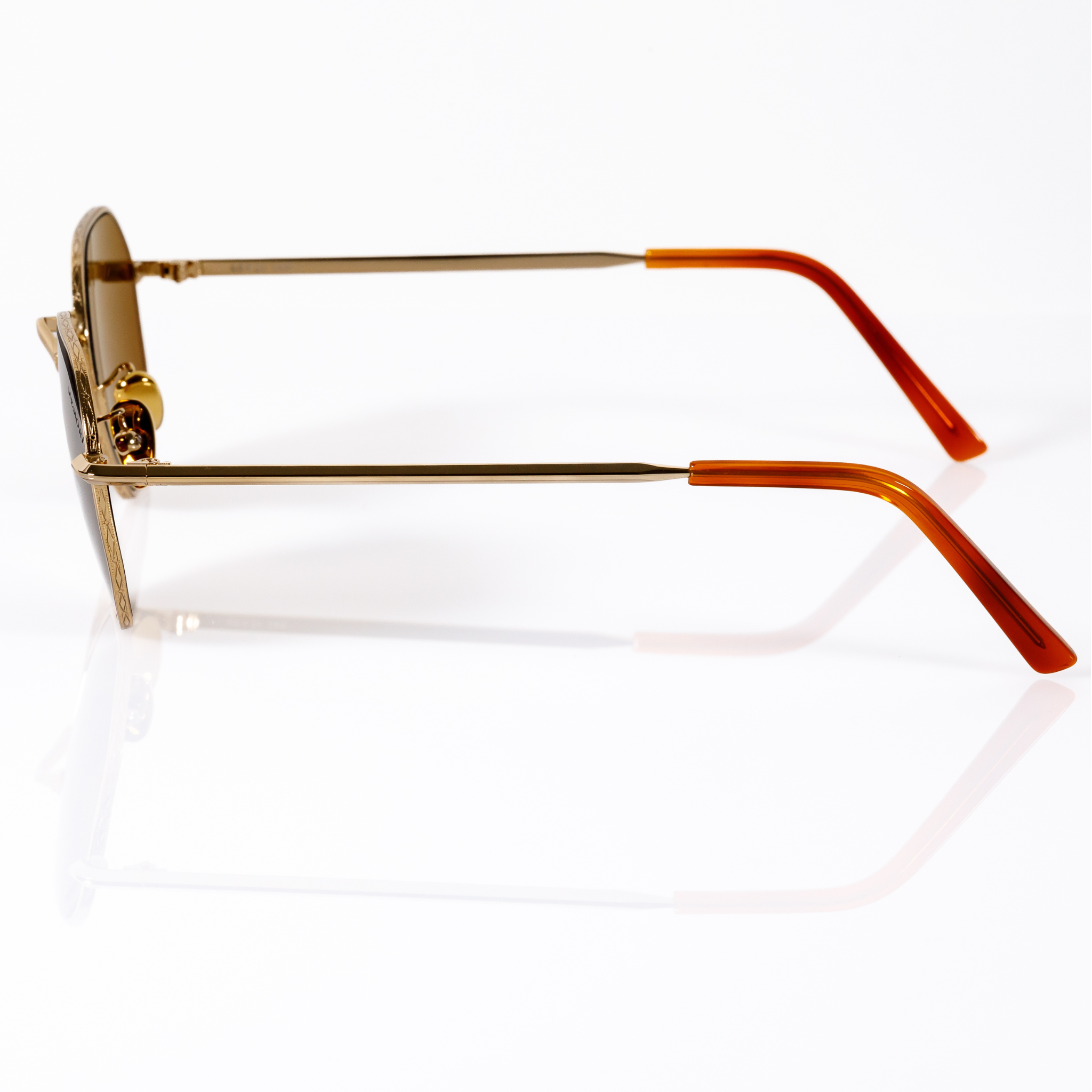 best sunglasses for small faces gold metal unisex, side view showcases V shaped nose bridge design detail and slight hexagonal edge to lens shape