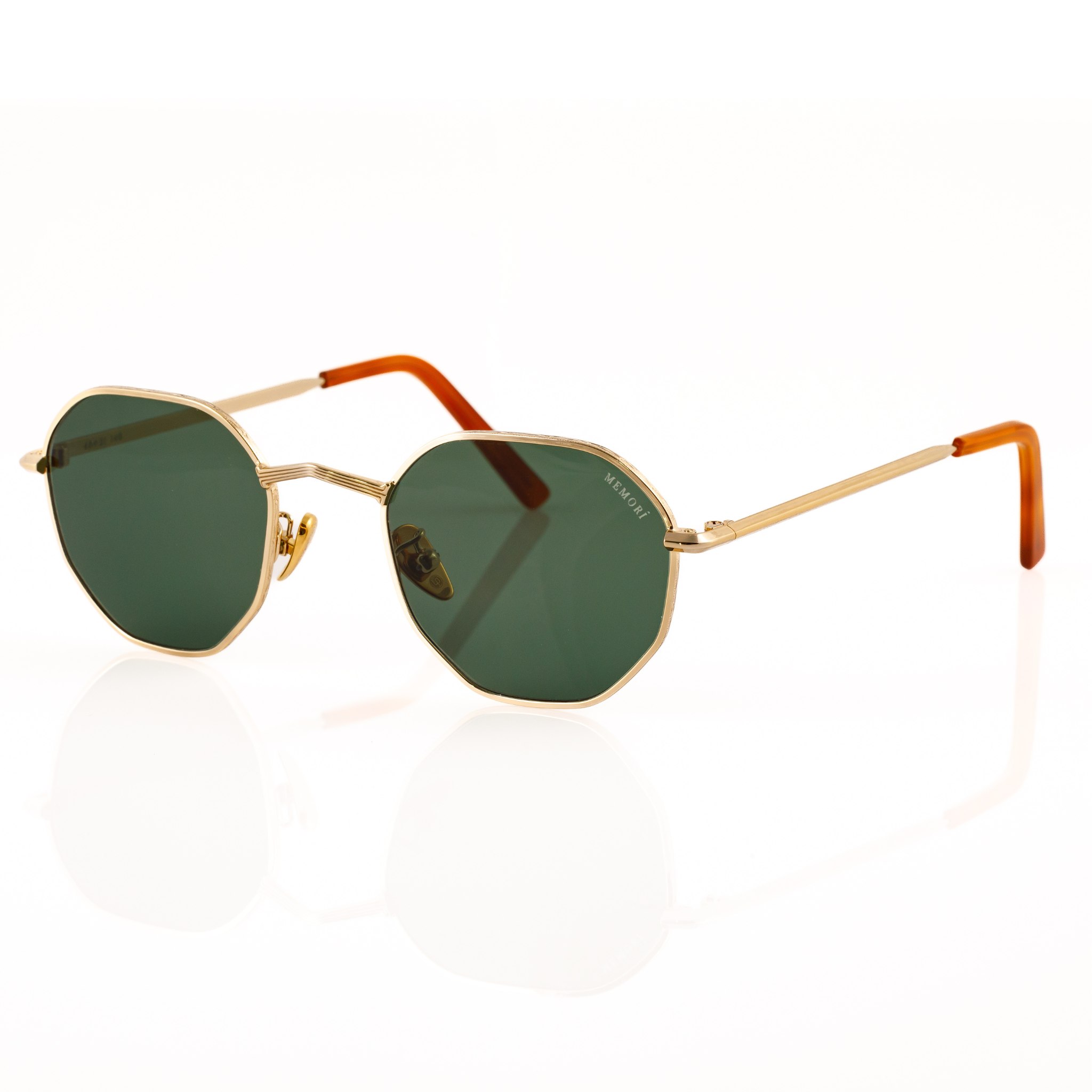 Best gold metal hexagon sunglasses for small faces for men or women. Features V nose bridge and green lenses. side view features metal linear etching on V nose bridge and "Memorí" logo written in upper corner of lens. 