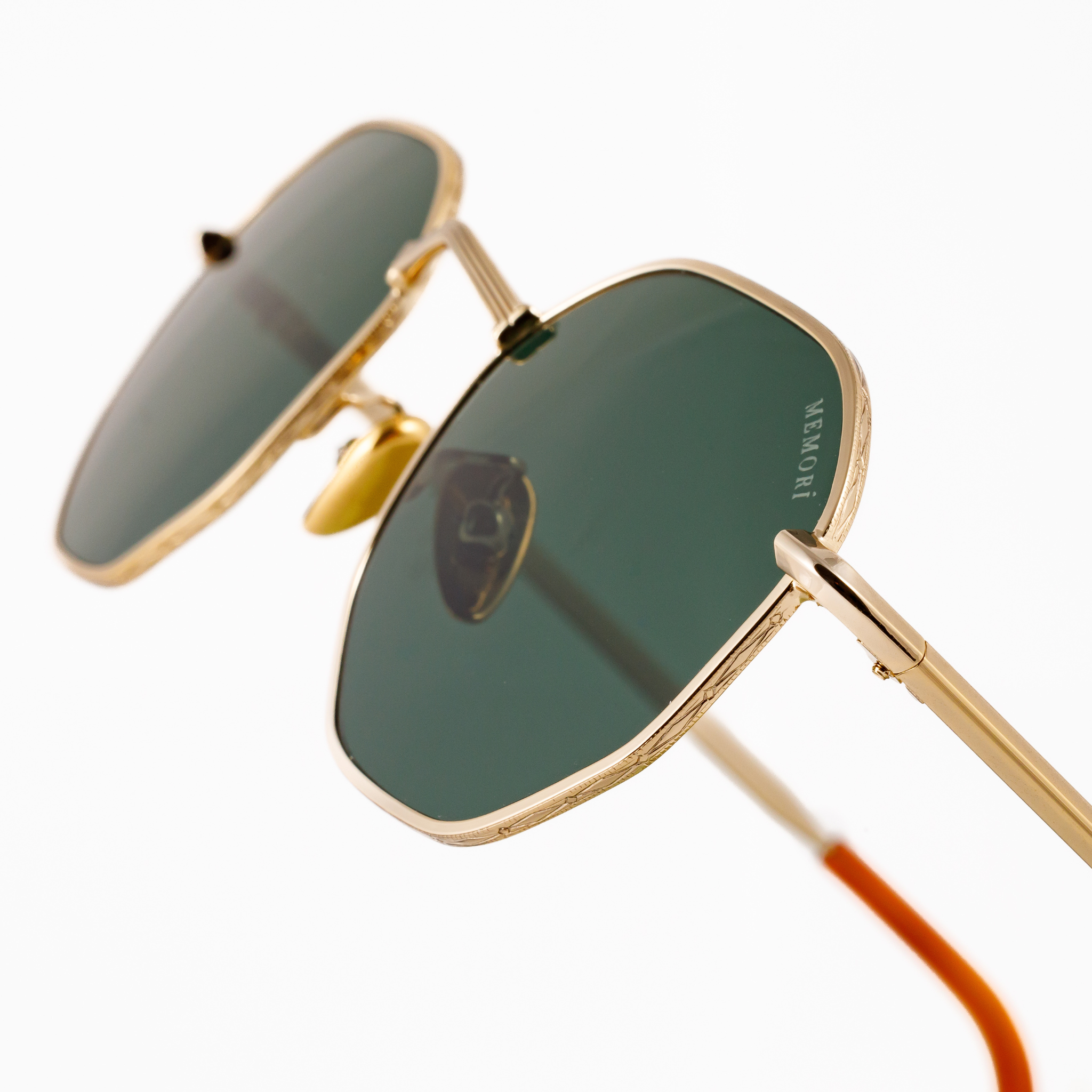 Best gold metal hexagon sunglasses for small faces for men or women. Features V nose bridge and green lenses. macro view shows edge detailing.
