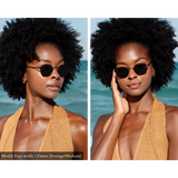 Model wearing Memorí sunglasses in a beach setting. Although these black hexagon sunglasses were designed for a small face, they still look beautiful on the model who has an average face shape.
