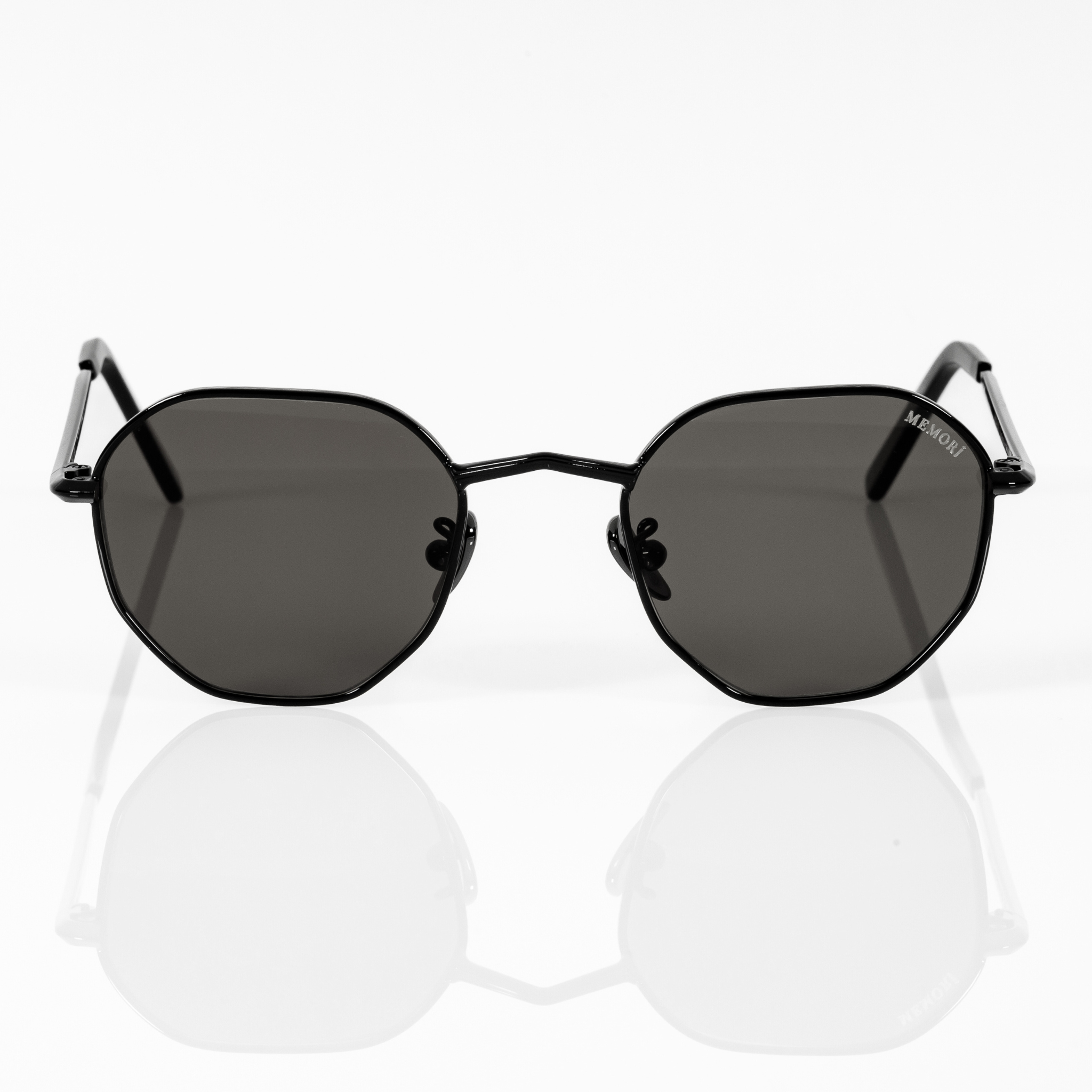 front view of memori black hexagon sunglasses with black polarized lens.