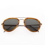 Memori aviator sunglasses with acetate rims, folded to show detail as if the sunglasses were laying on a table.