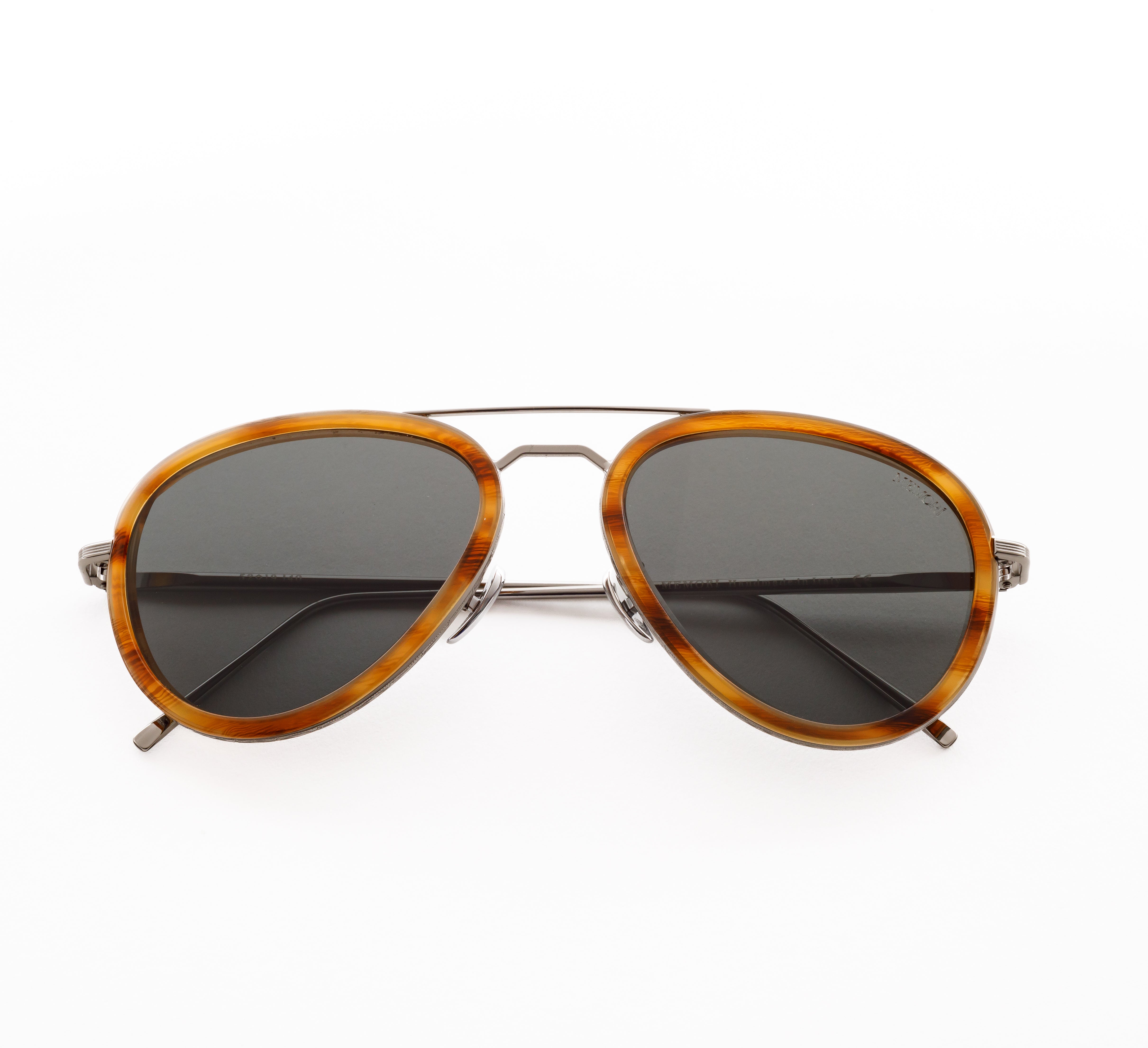 Memori aviator sunglasses with acetate rims, folded to show detail as if the sunglasses were laying on a table.