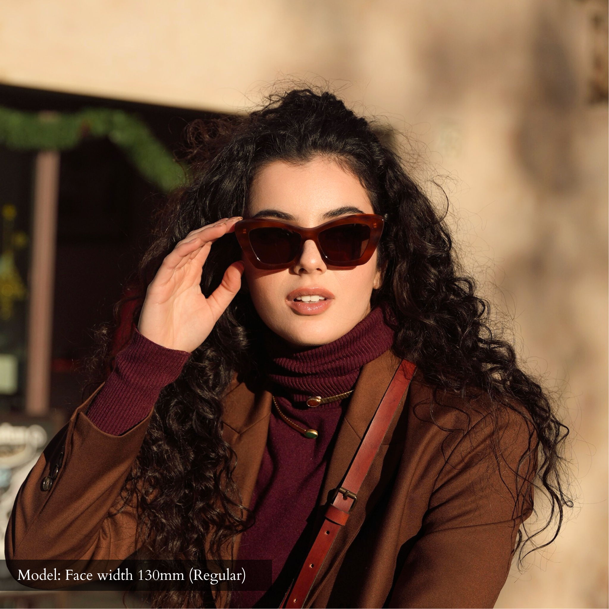 Model with regular width face wearing Memorí small fit sunglasses, which are designed specifically for petite faces.