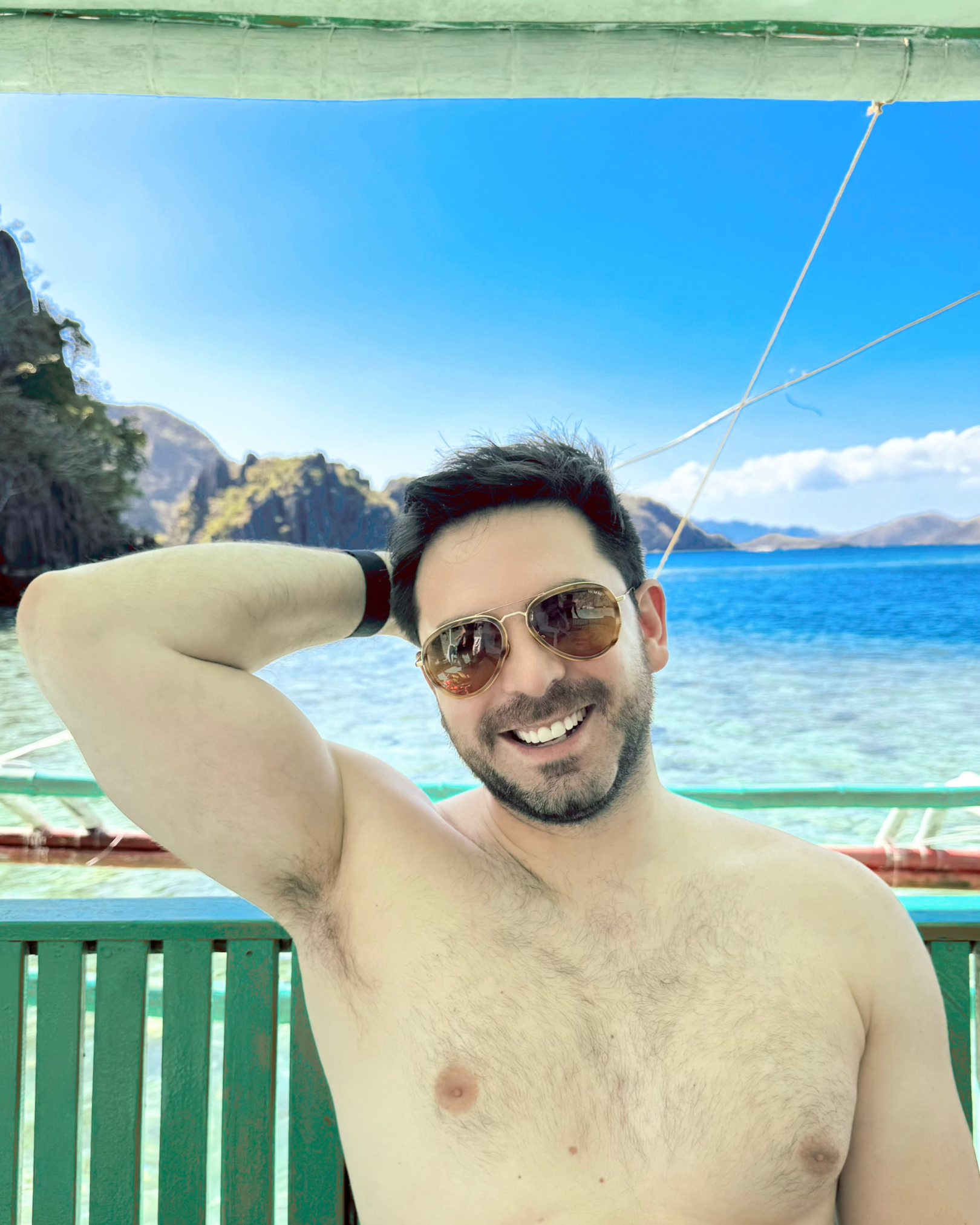 Man wearing Memori aviator sunglasses that do not overwhelm face, because they have a small lens shape and are the perfect sunglasses for men with a small head.