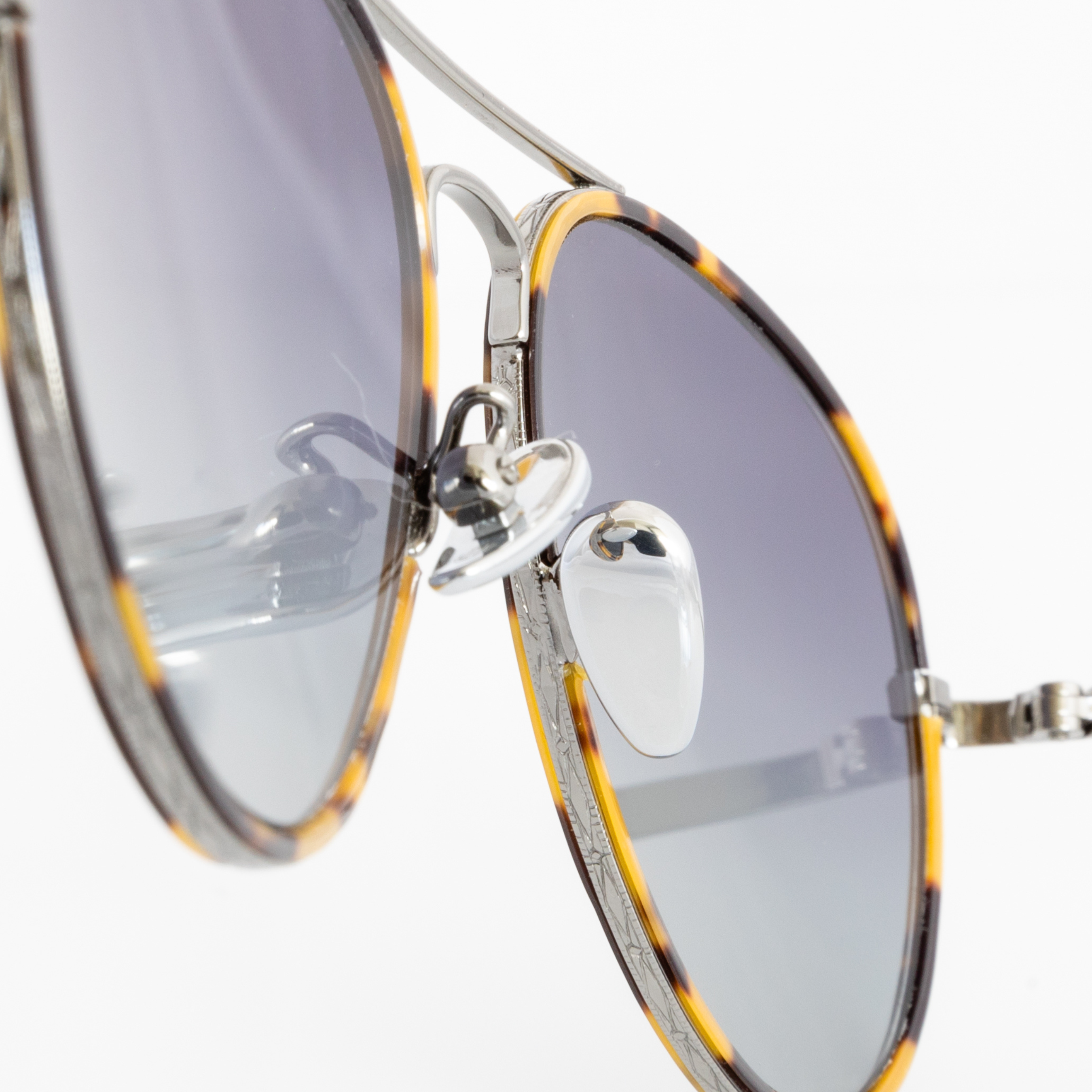 Memorí Aviator sunglasses. Small batch artisan sunglasses for smaller faces. Narrow width aviators. Macro view shows detailing. 