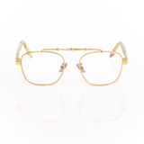 Front view of Memori Balaustra Aviator glasses on a white background. transparent lenses, gold frame, and ivory and light brown marbled acetate temple arms. Top bar has sculptural gold design details. 