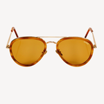 Forward view of aviator silhouette sunglasses on a white background. Lenses are a yellow/gold color, frame is gold, and there are acetate sheaths surrounding the lenses and at the temple tips in a brown color.