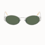 Sunglasses with green lenses and thin silver metal frame on a white background. silver leaf details in the metal are present at the nose bridge and at the external sides. 