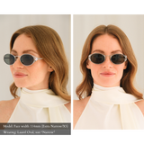 Side-By-Side photo of a woman with a small face shape wearing the Laurel Oval sunglasses in silver, size narrow. The green lenses are dark and almost appear gray on the face. One view is facing forward, one view looking to the side, exposing the intricate metal leaf blinder details on the external rim of the glasses. Model has a 114mm facial width (extra narrow/xs face shape) and the size narrow fits her perfectly