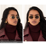 Side-By-Side photo of a woman with a small face shape wearing the Laurel Oval sunglasses in gold, size medium. The warm brown lenses are dark and we cannot easily see her eye. One view is facing forward, one view looking to the side, exposing the intricate metal leaf blinder details on the external rim of the glasses.