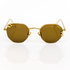 Gold metal sunglasses with brown lenses on a white background. Lens shape is geometric/hexagonal, with chunky gold hoop piercings through the lenses.Pierced sunglasses. Front view. 