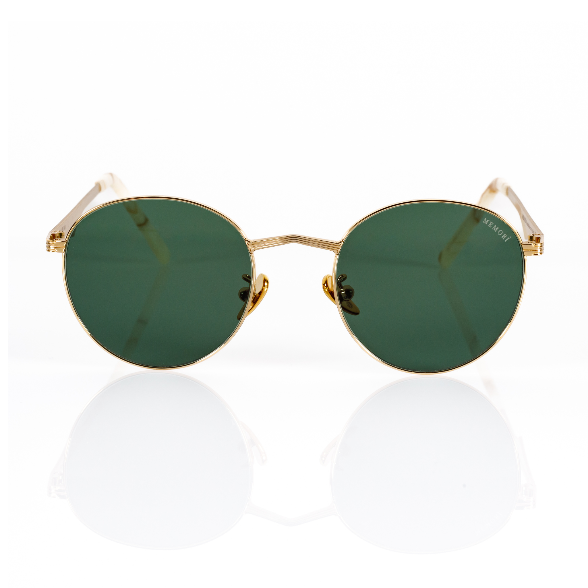 gold metal framed sunglasses with green lenses and a round lens shape on a white background. 