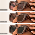Comparison of three lens options: Maroon (top) vs. Brown (middle) vs. Black (bottom)  in the same maroon marbled frame. The brown lenses are slightly darker and appear to let less light through than the maroon. Black is the darkest and blocks the most light. Gold "Memorí" logo is also visible on the temple arm. 