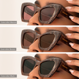Comparison of three lens options: Maroon (top) vs. Brown (middle) vs. Black (bottom)  in the same maroon marbled frame. The brown lenses are slightly darker and appear to let less light through than the maroon. Black is the darkest and blocks the most light. Gold "Memorí" logo is also visible on the temple arm. 
