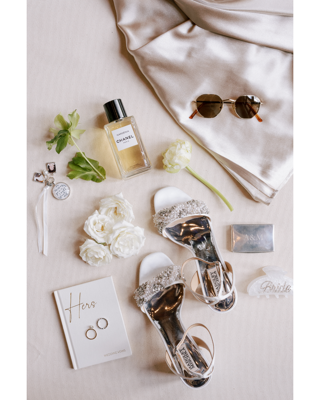 bridal flat lay inspo with sunglasses, shoes, and vow books