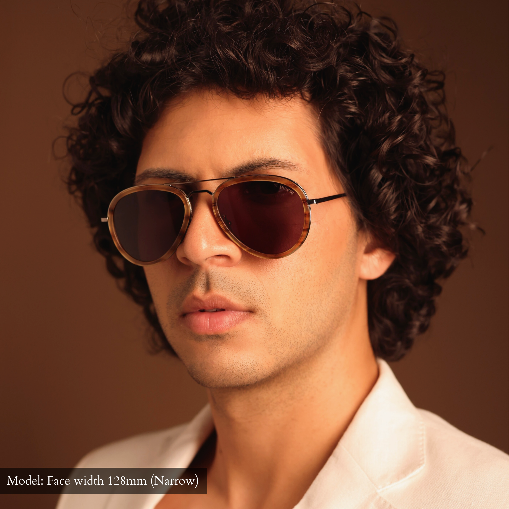 Model wearing the Memori Aviator sunglasses frame. View is from the front, the hexagonal nose bridge and the tortoise acetate inlay sheaths add a lot of individualism into a classic frame shape. 