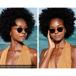Model wearing Memorí sunglasses in a beach setting. Although these black hexagon sunglasses were designed for a small face, they still look beautiful on the model who has an average face shape. 