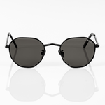 front view of memori black hexagon sunglasses with black polarized lens. 