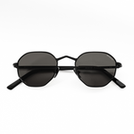 Product photo of Memorí black hexagon small fit sunglasses. Folded position shows the geometric V nose bridge shape, which is elegant yet edgy and elevates the design. 
